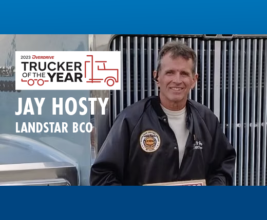 Jay Hosty posing in front of a truck