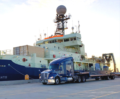 Landstar step deck trailer at port.